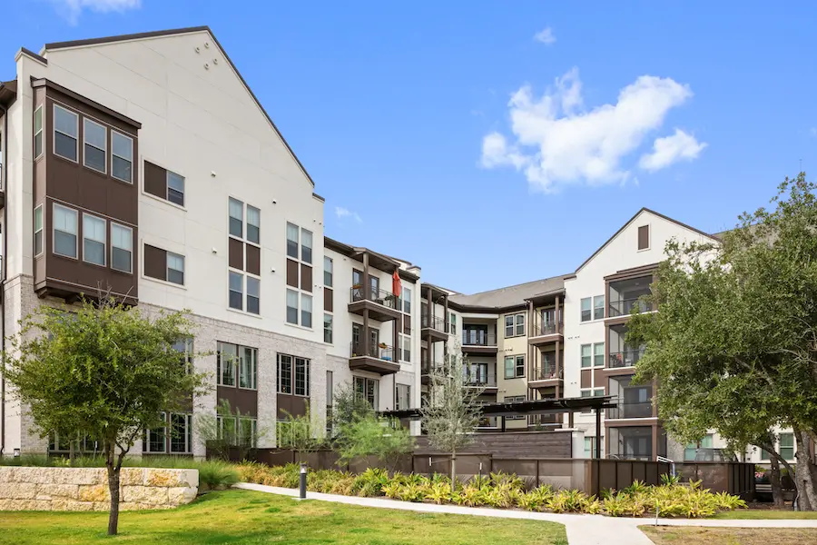 A view of an apartment complex with many balconies.