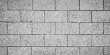 A brick wall with some type of pattern on it